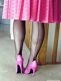 This honey looks stunning in a pink dress and high heels