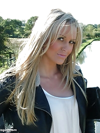 Gorgeous blonde Erin is outdoors showing off her shiny..