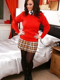 Brunette strips out of her college uniform after a long..