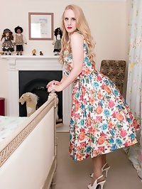 Lucy in a delightful floral full skirted dress, lacy..
