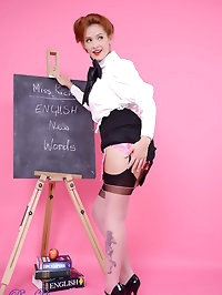 Strict teacher Elle Richie in black stocking stripteases..